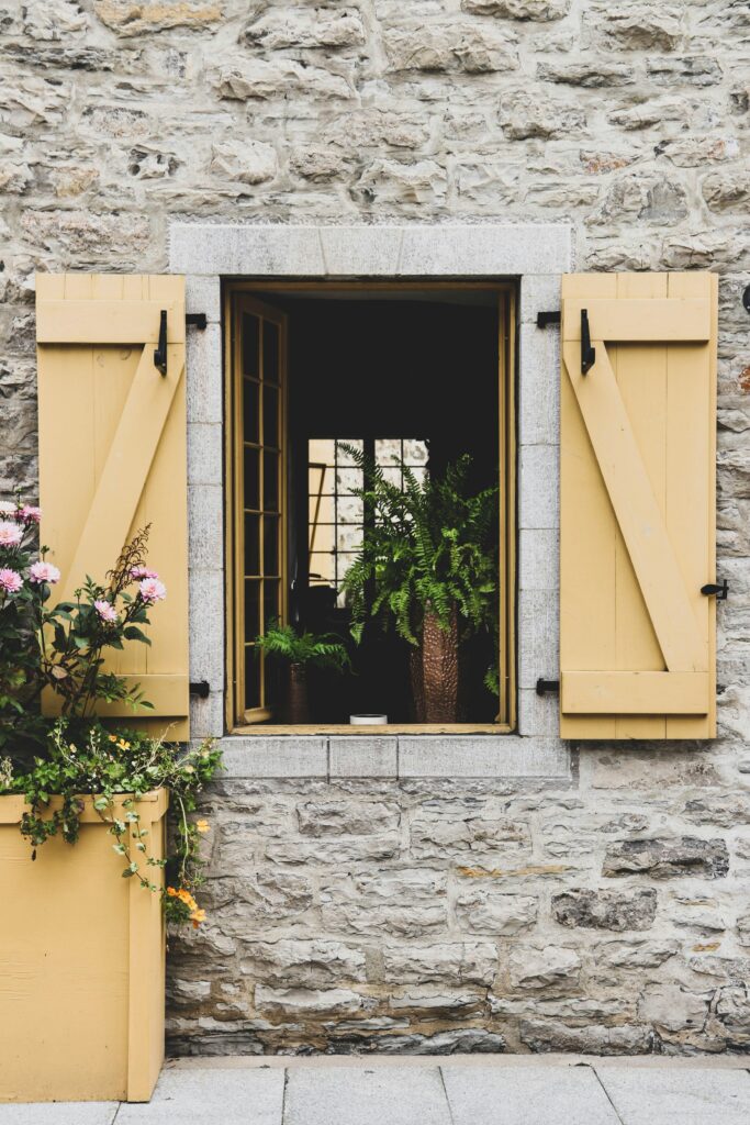 Wall-mounted gardens with herbs and flowers.